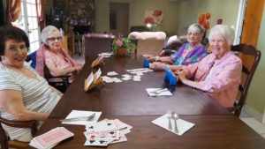 Residents at Colten Adult Care playing cards